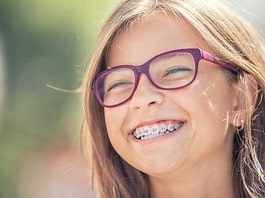 Smiling young girl with braces