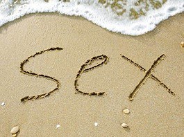 Sex written on the beach