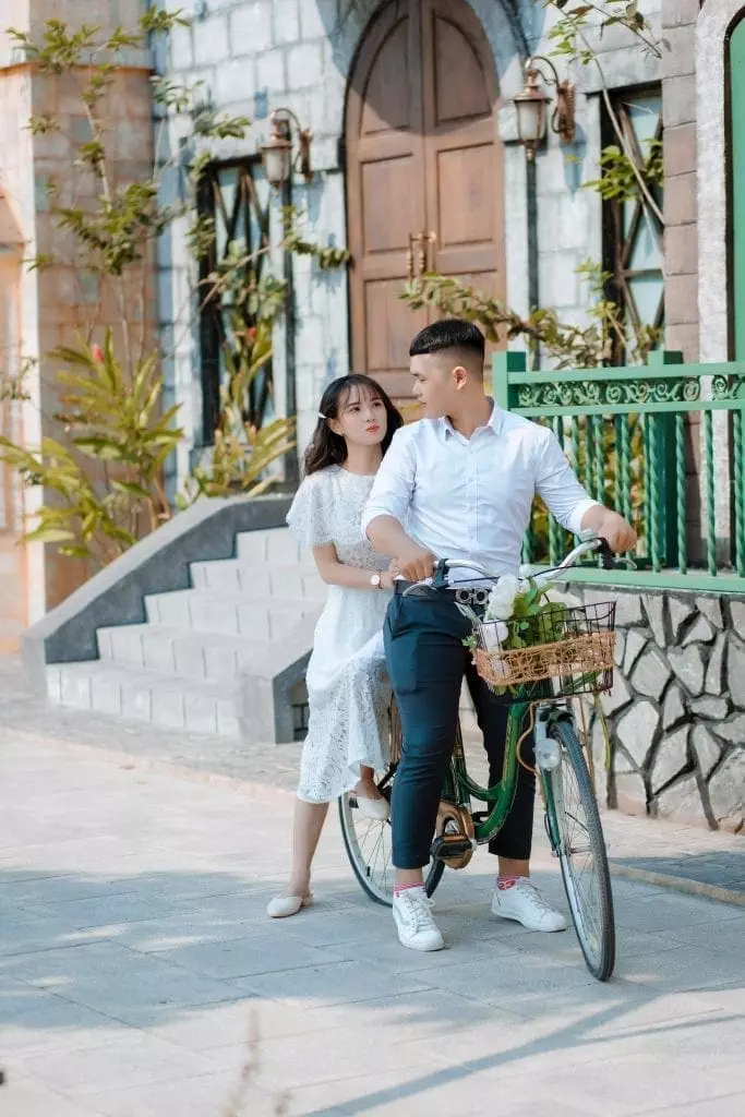 man-and-woman-riding-green-bicycle-3690665