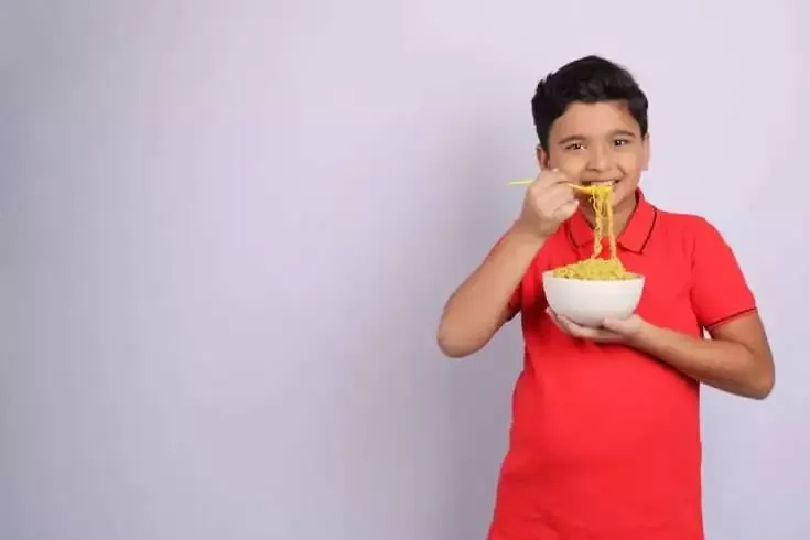 Everything You Need to Know About the Ban on MAGGI (It's Back!) 10 A young child eating maggi