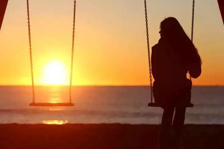 Lonely Me - A Poem 5 Lonely woman sitting on the swings alone