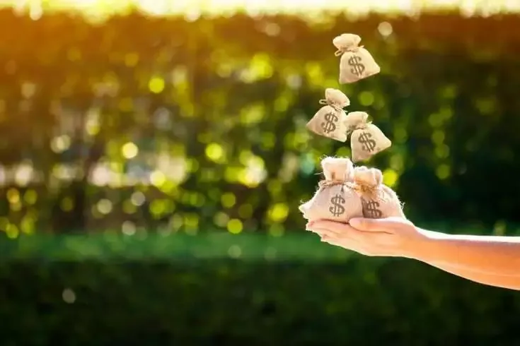 How to Save Water on Regular Basis - The Perfect Guide 8 Woman holding bags of money
