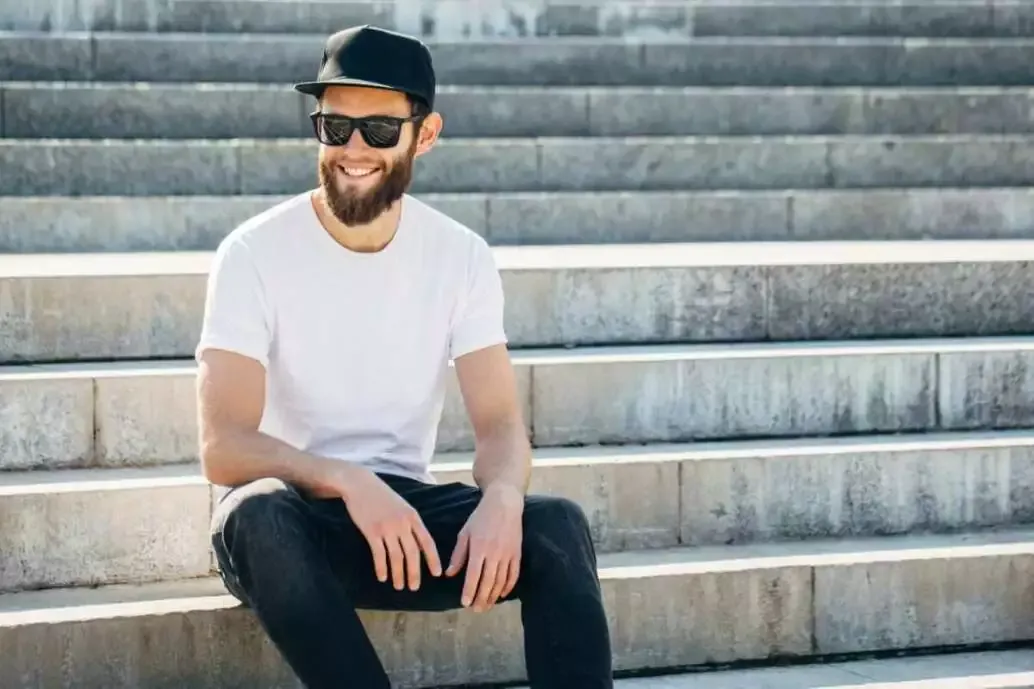 5 Simple Steps to Buy the Best T-Shirts for Men 6 Hipster handsome male model with beard wearing white blank t-shirt with space for your logo or design in casual urban style.
