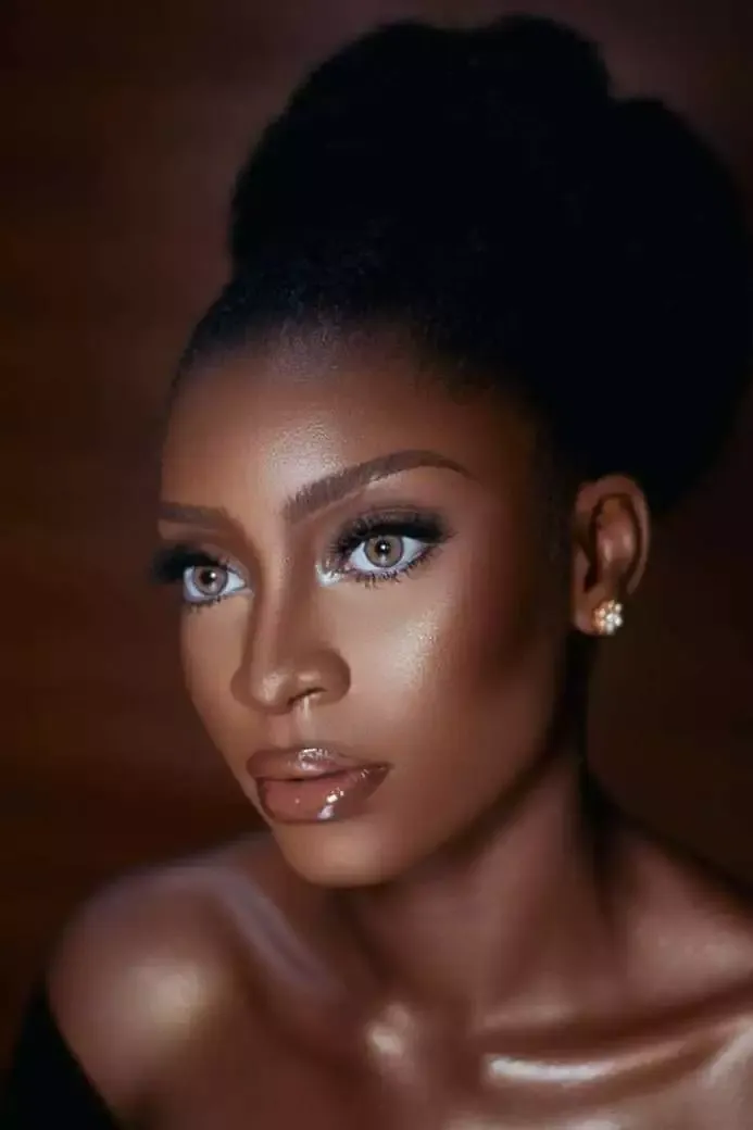 How to Do Makeup at Home (Best Guide of 2022) 21 Woman wearing lip gloss