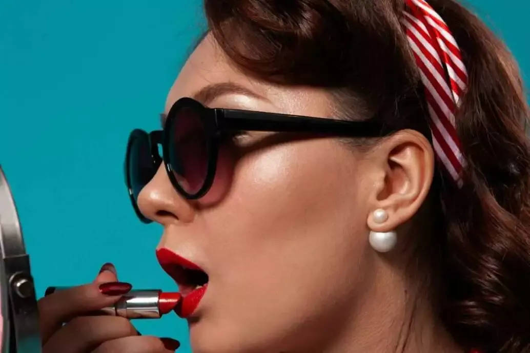 How to Do Makeup at Home (Best Guide of 2022) 20 Woman applying lipstick
