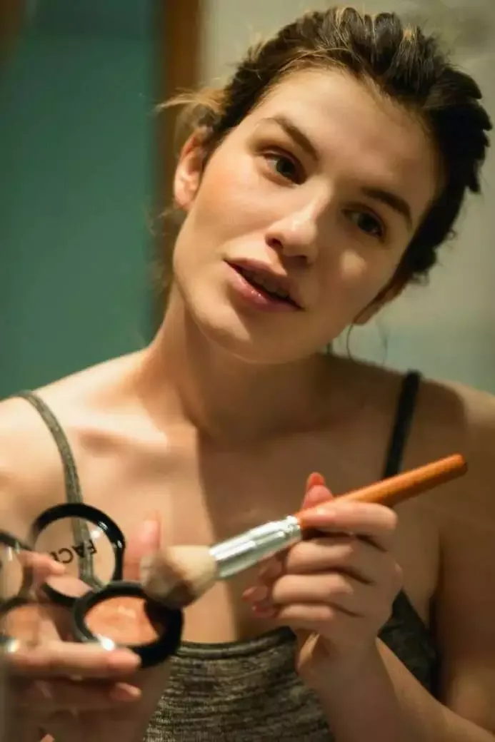 How to Do Makeup at Home (Best Guide of 2022) 13 woman applying blush