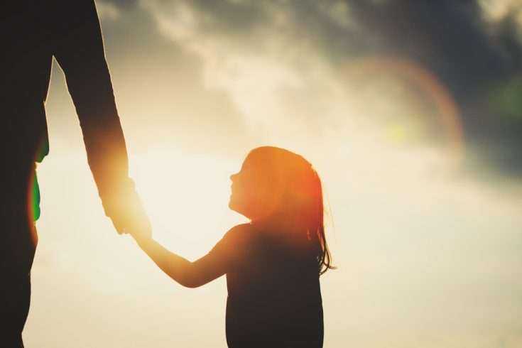 A Daughter's Pride 8 Silhouette of a father holding his daughter's hand