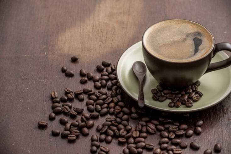 What Is an Americano? Know the Best Facts in 10 Minutes! 12 coffee americano with coffee beans on wooden table