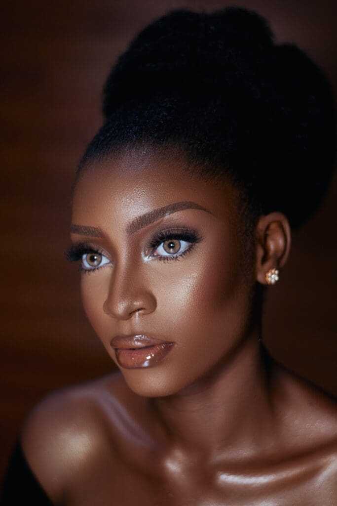 How to Do Makeup at Home (Best Guide of 2022) 22 Woman wearing lip gloss