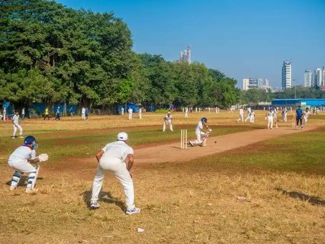 10 Reasons Why Mumbai Is One Of The Best Cities Ever 10 Kids playing cricket at a local ground in Mumbai,India