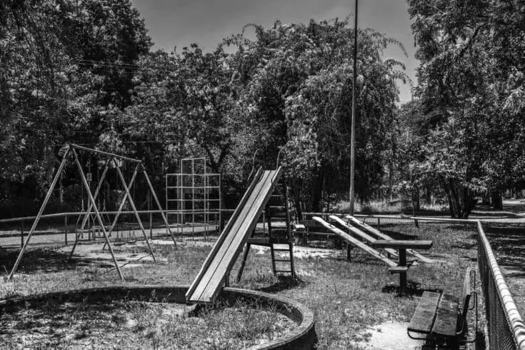 The days are gone. old playground in black and white