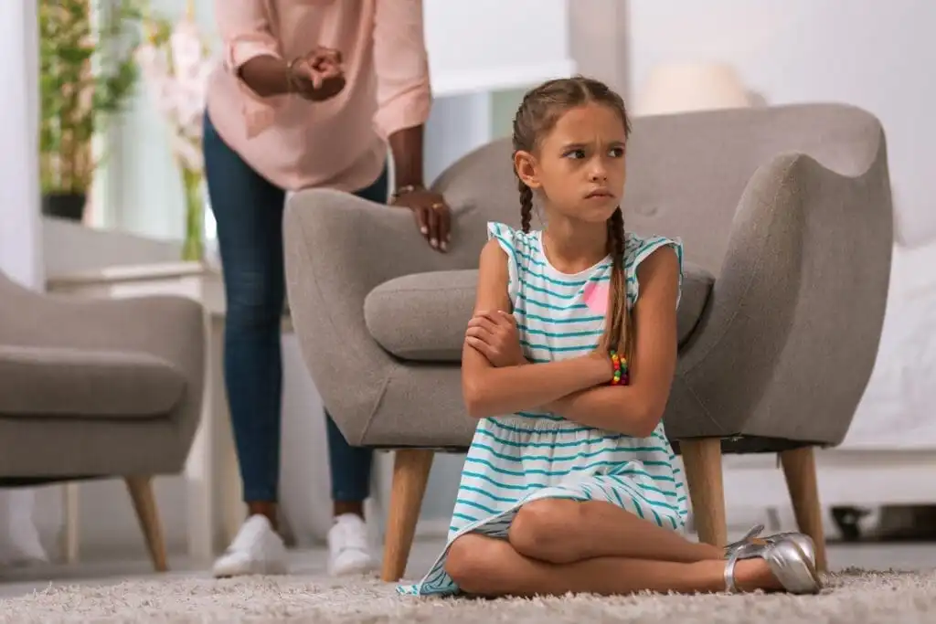 5 Valuable Perks of Living with Strict Parents! 8 Sad mood. Unhappy gloomy girl sitting cross handed while being angry at her parents