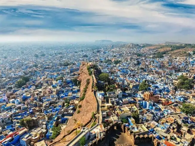 Why You Should Visit Rajasthan at Least Once in Your Life 9 Aerial view of Jodhpur, also known as Blue City due to the vivid blue-painted Brahmin houses around Mehrangarh Fort. Jodphur, Rajasthan