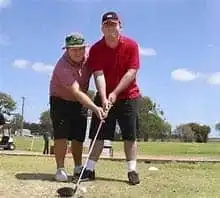 7 Best Golf Schools in Florida 10 a student being trained on the Golf field.