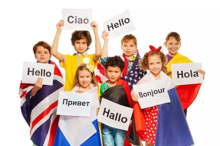 Kids holding greeting cards of different languages
