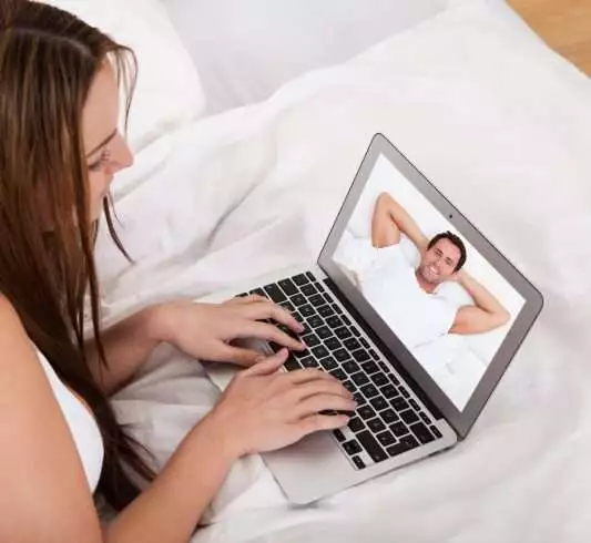 Woman talking over video call with boyfriend