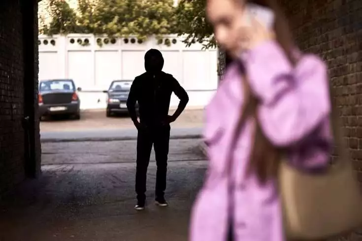 Man stalking a woman